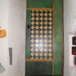 Painted diamond pattern on green door